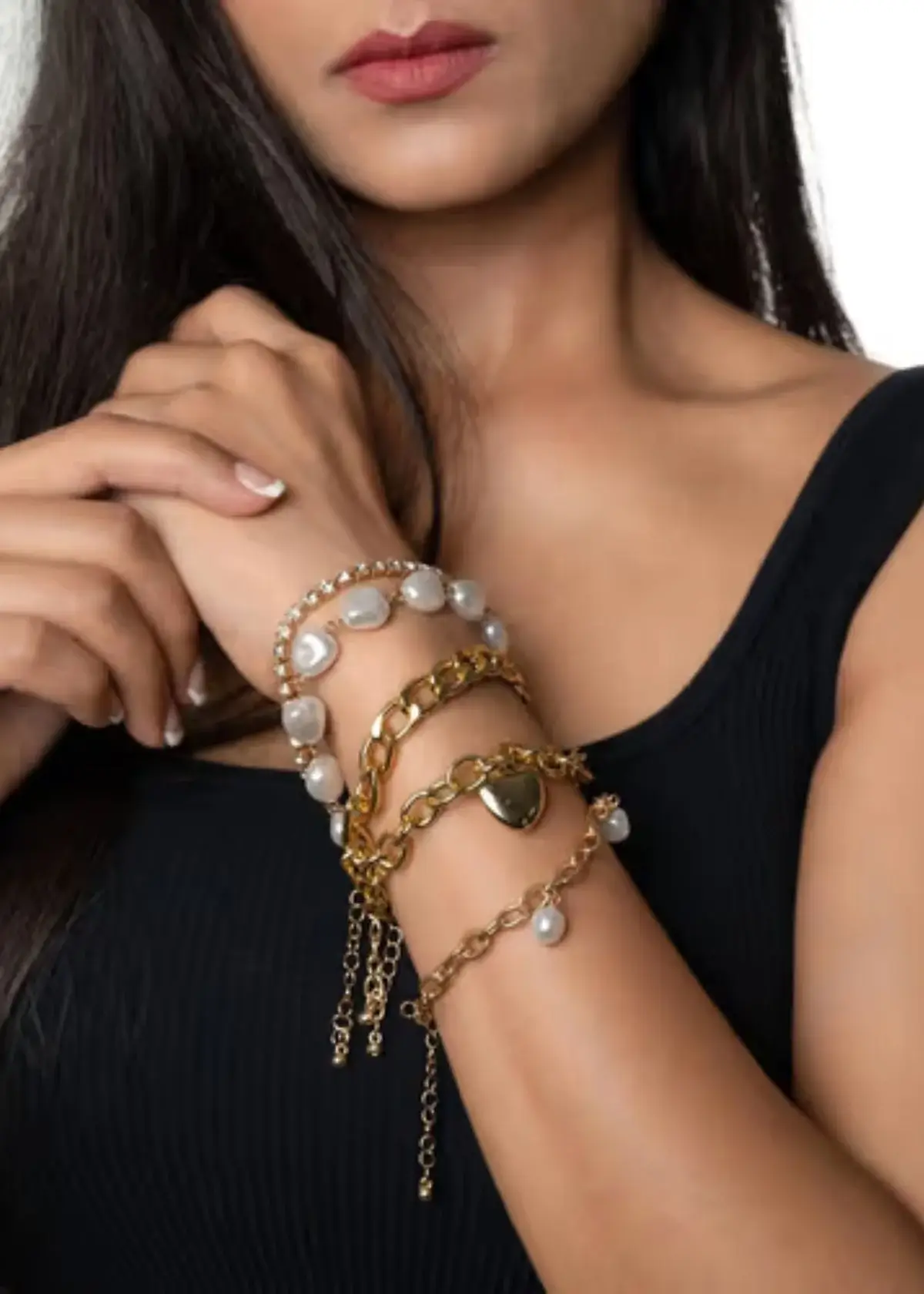 What is the concept behind layering bracelets?