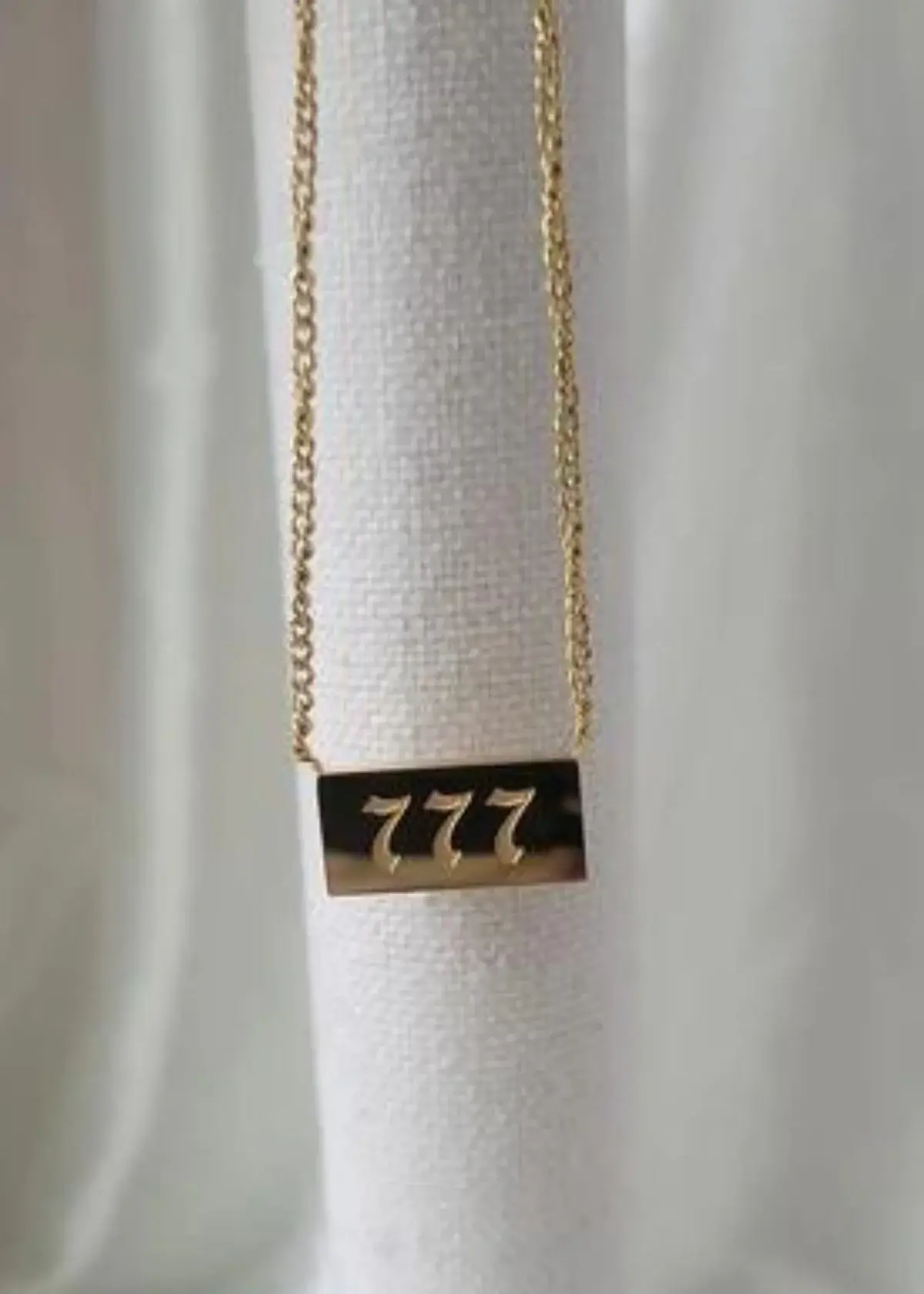 what does 777 mean on a necklace?