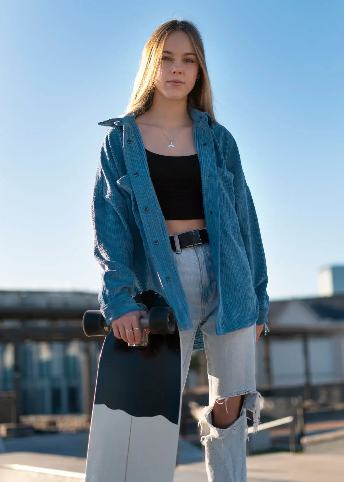 What are the key features of an oversized denim jacket?